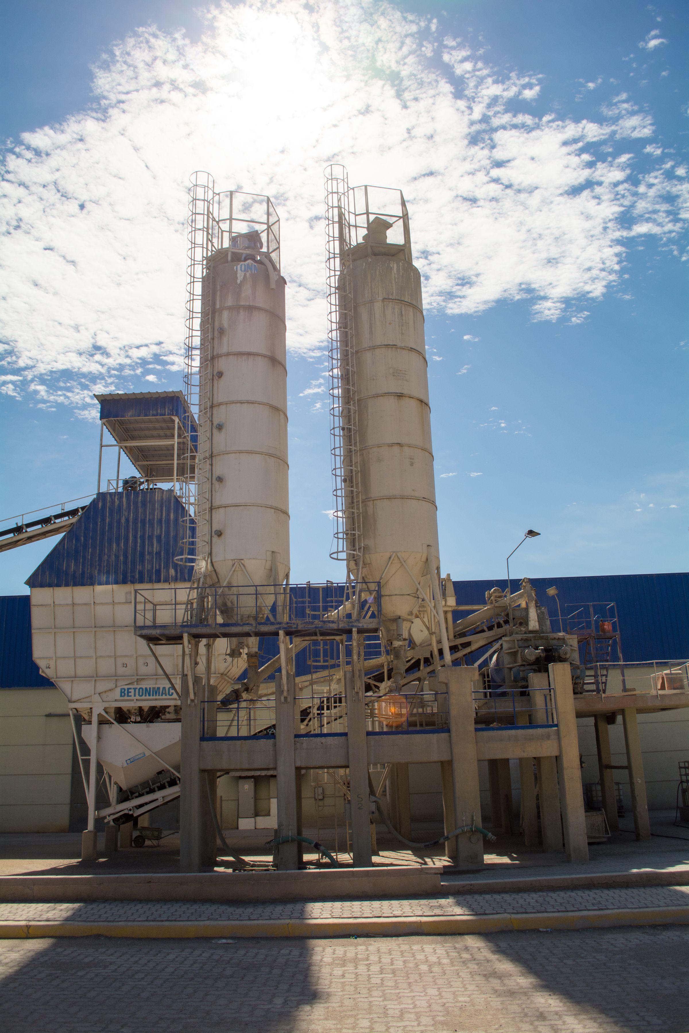 Storage silos and bulk material handling equipment at an industrial plant